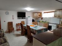 A kitchen or kitchenette at TITI' appartamento vacanze La Corte