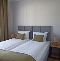 Łóżko lub łóżka w pokoju w obiekcie Flauta Apartamenty Rodzinne