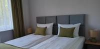 Łóżko lub łóżka w pokoju w obiekcie Flauta Apartamenty Rodzinne