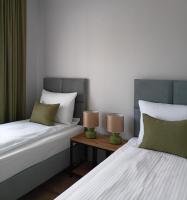 Łóżko lub łóżka w pokoju w obiekcie Flauta Apartamenty Rodzinne