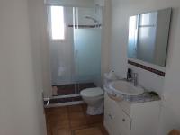 a bathroom with a shower and a toilet and a sink at Chambre d&#39;hôtes in Valras-Plage