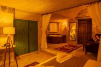 Postel nebo postele na pokoji v ubytování Carmin Cave Hotel