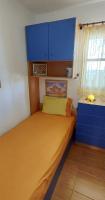A bed or beds in a room at Wooden beach house / Nea Roda, Halkidiki