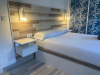 A bed or beds in a room at SANTA PAULA CENTRO JUNTO CATEDRAL center