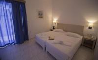 A bed or beds in a room at Frida Apartments