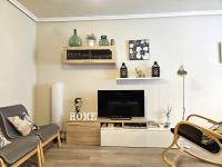 Televízia a/alebo spoločenská miestnosť v ubytovaní Apartamento DACTONIUM - Ribeira Sacra