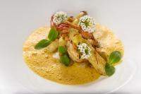 a plate of food with shrimp and greens on it at CHATEAU R in Wettolsheim