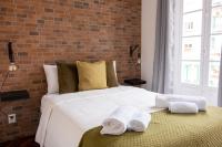 Postel nebo postele na pokoji v ubytování Alameda Apartments & Rooms