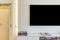 Televízia a/alebo spoločenská miestnosť v ubytovaní Apartamento Mar