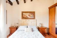 Postel nebo postele na pokoji v ubytování Masia Castellvi B&B