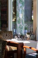 a table with wine glasses on top of it at Grand Hotel Monopole in Valkenburg