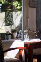 a table with two wine glasses on top of it at Grand Hotel Monopole in Valkenburg