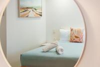 a bedroom with a bed with a mirror at Roydons Motor Inn in Tamworth