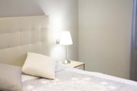 Postel nebo postele na pokoji v ubytování Apartamenticos Plaza Las Armas