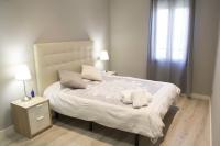 Postel nebo postele na pokoji v ubytování Apartamenticos Plaza Las Armas