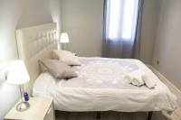 Postel nebo postele na pokoji v ubytování Apartamenticos Plaza Las Armas
