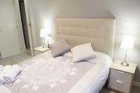 Postel nebo postele na pokoji v ubytování Apartamenticos Plaza Las Armas