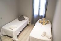 Postel nebo postele na pokoji v ubytování Apartamenticos Plaza Las Armas