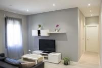 TV a/nebo společenská místnost v ubytování Apartamenticos Plaza Las Armas