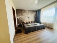 Postel nebo postele na pokoji v ubytování BNP Apartments 1