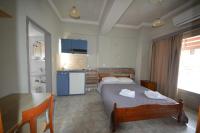 Posteľ alebo postele v izbe v ubytovaní Bikakis Family Apartments