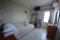Posteľ alebo postele v izbe v ubytovaní Bikakis Family Apartments