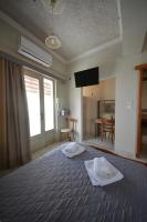 Posteľ alebo postele v izbe v ubytovaní Bikakis Family Apartments