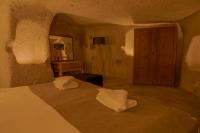 Postel nebo postele na pokoji v ubytování Carmin Cave Hotel