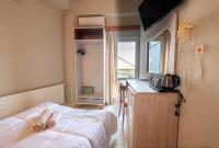 Posteľ alebo postele v izbe v ubytovaní Bikakis Family Apartments
