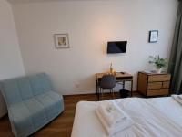Postel nebo postele na pokoji v ubytování Hotel Legie