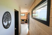 Televízia a/alebo spoločenská miestnosť v ubytovaní Cottage chaleureux avec Sauna & Jacuzzi