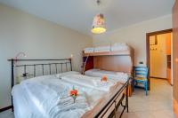 A bed or beds in a room at Casa Angiolina Lake And Mountain View - Happy Rentals