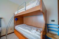A bed or beds in a room at Casa Angiolina Lake And Mountain View - Happy Rentals
