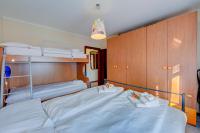 A bed or beds in a room at Casa Angiolina Lake And Mountain View - Happy Rentals