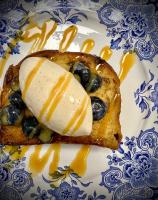 a piece of bread with cheese and olives on a plate at Li Ter Hôtel in Marche-en-Famenne