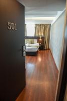 Postel nebo postele na pokoji v ubytování Amorgos Boutique Hotel
