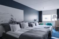 Ein Bett oder Betten in einem Zimmer der Unterkunft Clarion Hotel Sign