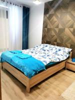 Posteľ alebo postele v izbe v ubytovaní Apartament Kasprowicza