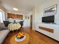 a living room with a table with fruit on it at Apartment Danica in Malinska