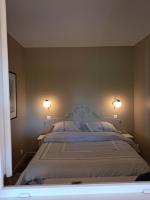 Katil atau katil-katil dalam bilik di 2 pi&egrave;ces avec piscine chauff&eacute;e
