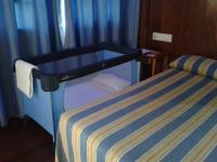 Postel nebo postele na pokoji v ubytování Hotel Castillo de Gauzón