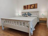 A bed or beds in a room at Pavoncelle Holidays Home