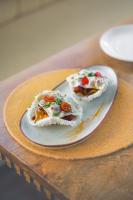 dos trozos de comida en un plato en una mesa en Aura Boutique Hotel, en Udaipur