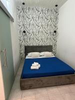 Łóżko lub łóżka w pokoju w obiekcie B&B Regina Rooms