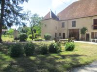 a house with a table and chairs in the yard at Appartement La petite Résie in La Résie-Saint-Martin