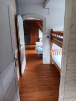 a hallway with two bunk beds and an open door at Superbe gite au centre de Kaysersberg avec 3 chambres in Kaysersberg