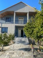 a house with stairs in front of it at The Hideaway Guesthouse in Bahçallëk
