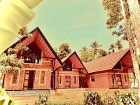 a house with a red roof at Senthamarai homestay in Sultan Bathery