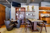 a dining room with two tables and chairs at Naivara Boutique Hotel in Udaipur