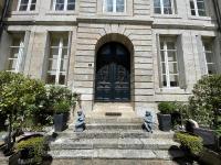 a building with statues in front of a door at Le villequier 8 Rouen centre in Rouen